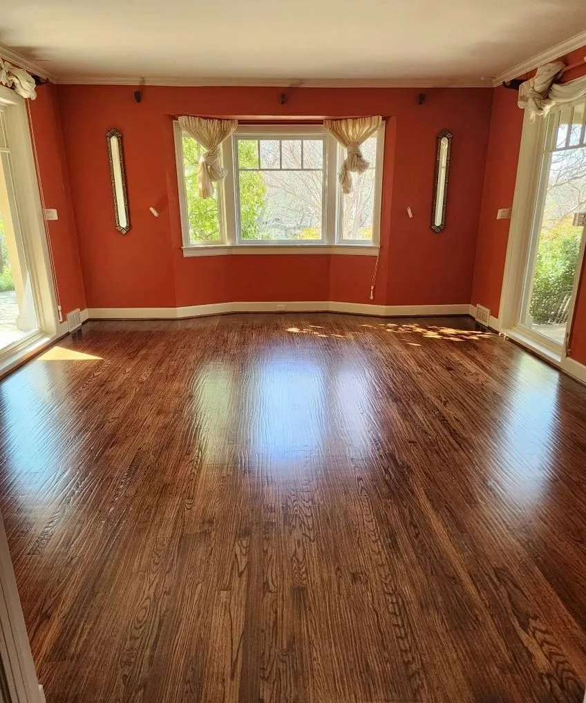 Dark-toned hardwood flooring in a Forney, TX living room installed by Artistry Floors