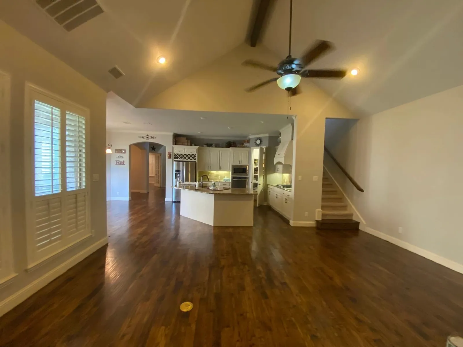 Hardwood flooring installed through an open-plan living area of a Dallas–Fort Worth, TX home by Artistry Floors